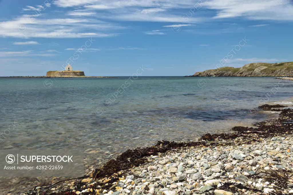 Wales, Anglesey, near Aberffraw. St Cwyfan's Church, known as the Church in the Sea, on a small tidal island called Cribinau off the coast of Anglesey.