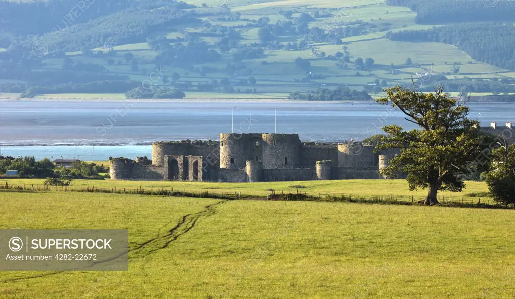 Wales, Anglesey, Beaumaris. Beaumaris Castle overlooking the Menai Strait on the Isle of Anglesey was built as one of the 'iron ring' of North Wales castles by King Edward I.