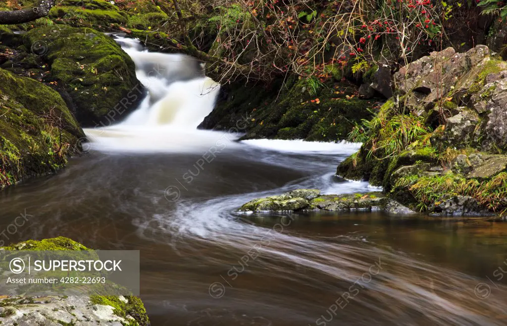 England, Cumbria, Glenridding. Water flowing in a stream in the Lake District.