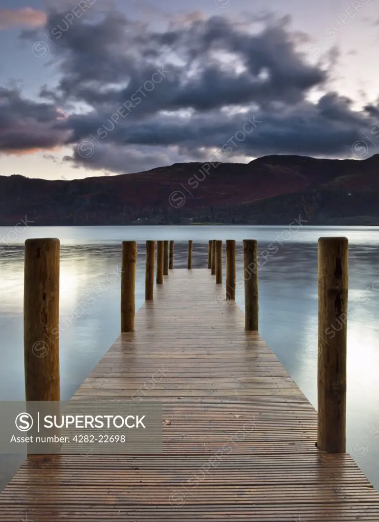 England, Cumbria, Derwentwater. Wooden landing stage at Derwentwater on a calm morning in the Lake District.