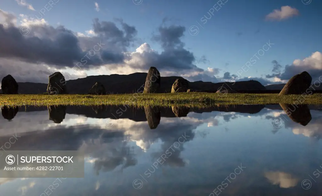 England, Cumbria, near Keswick. Castlerigg Stone Circle, one of the most visually impressive prehistoric monuments in Britain, reflected in a pool of water.