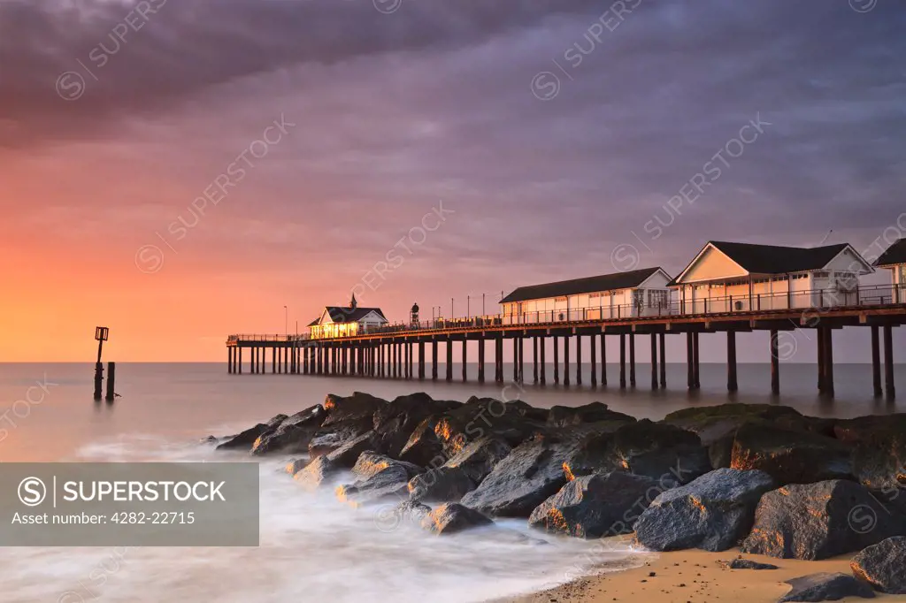 England, Suffolk, Southwold. Dawn sunlight on Southwold pier.