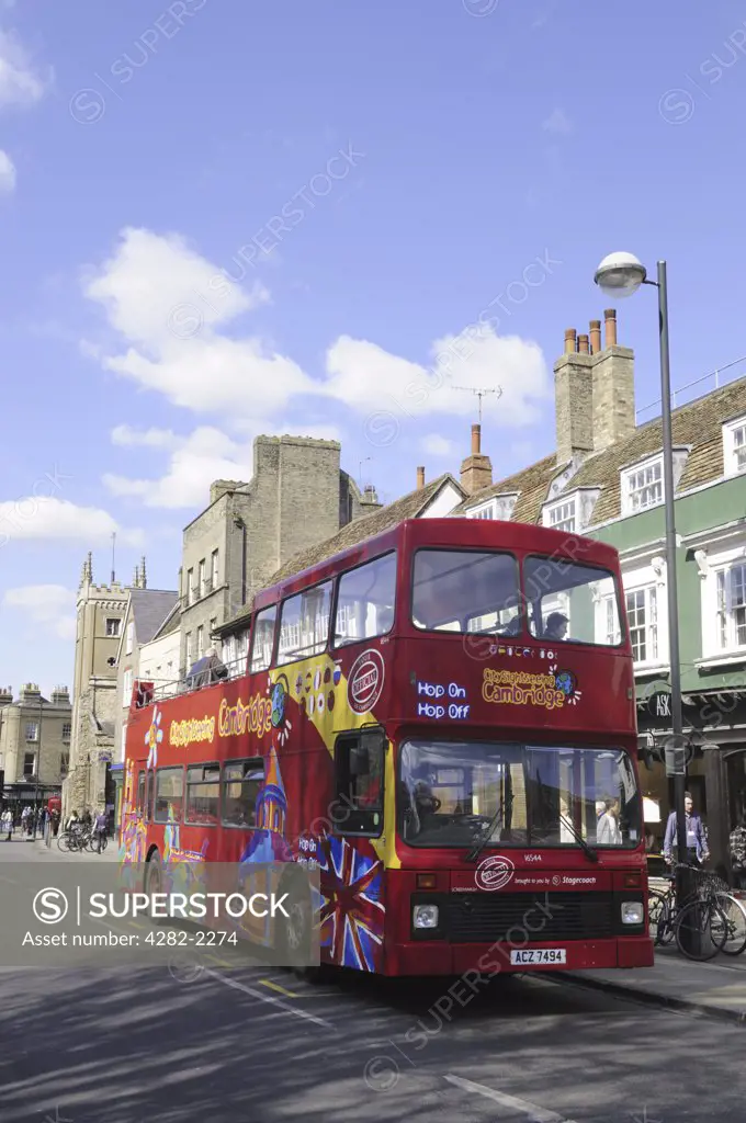 England, Cambridgeshire, Cambridge. A double decker City Sightseeing tourist bus on Bridge Street.