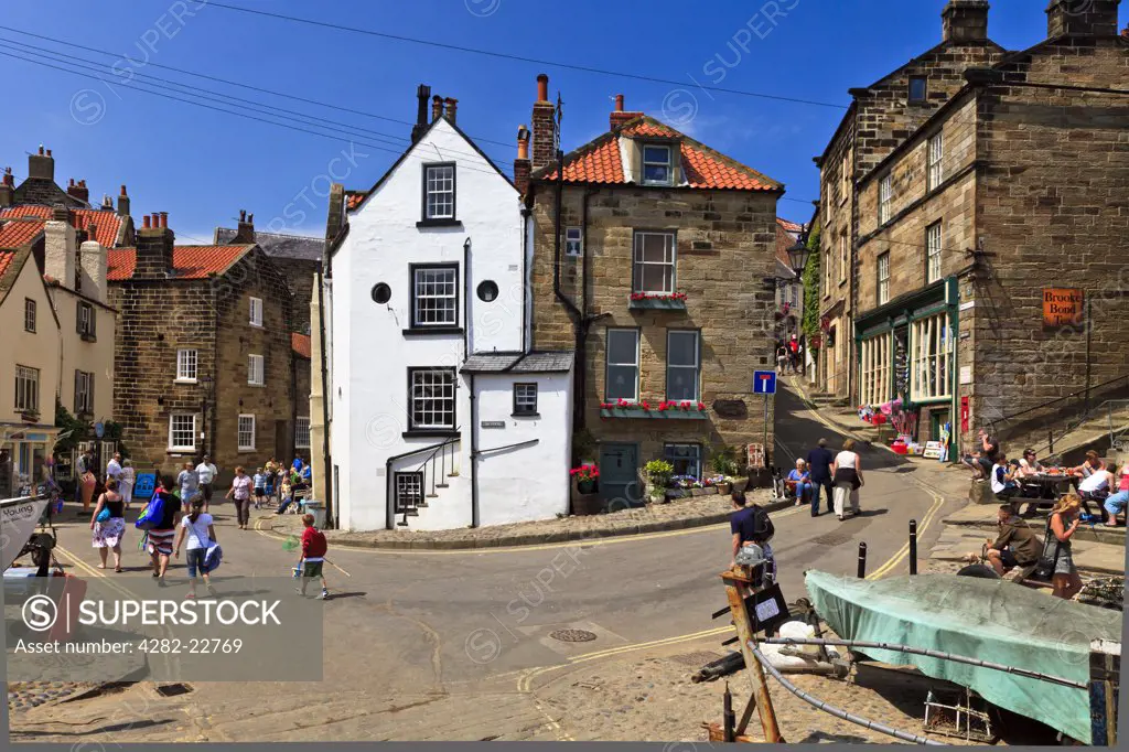 England, North Yorkshire, Robin Hood's Bay. Tourists in the centre of Robin Hood's Bay, the busiest smuggling community on the Yorkshire coast during the 18th century.