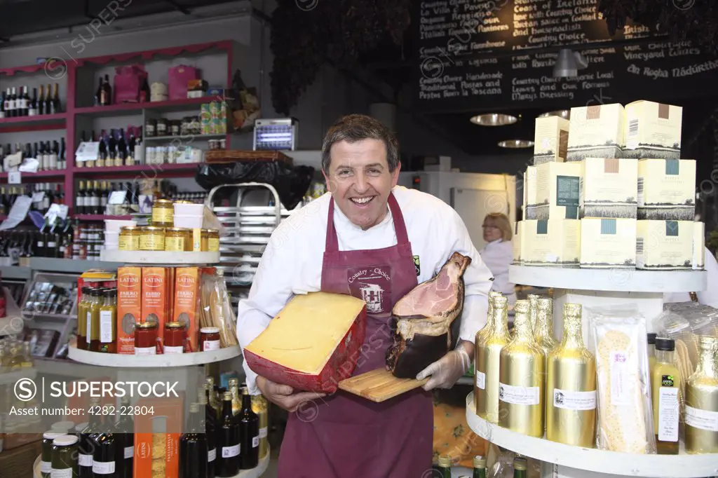 Republic of Ireland, County Limerick, Limerick. Peter Ward, proprietor of Country Choice, a gourmet food retail outlet in the Milk Market, an historic market providing a wide variety of fresh, local, in-season products, typically directly from the producer.