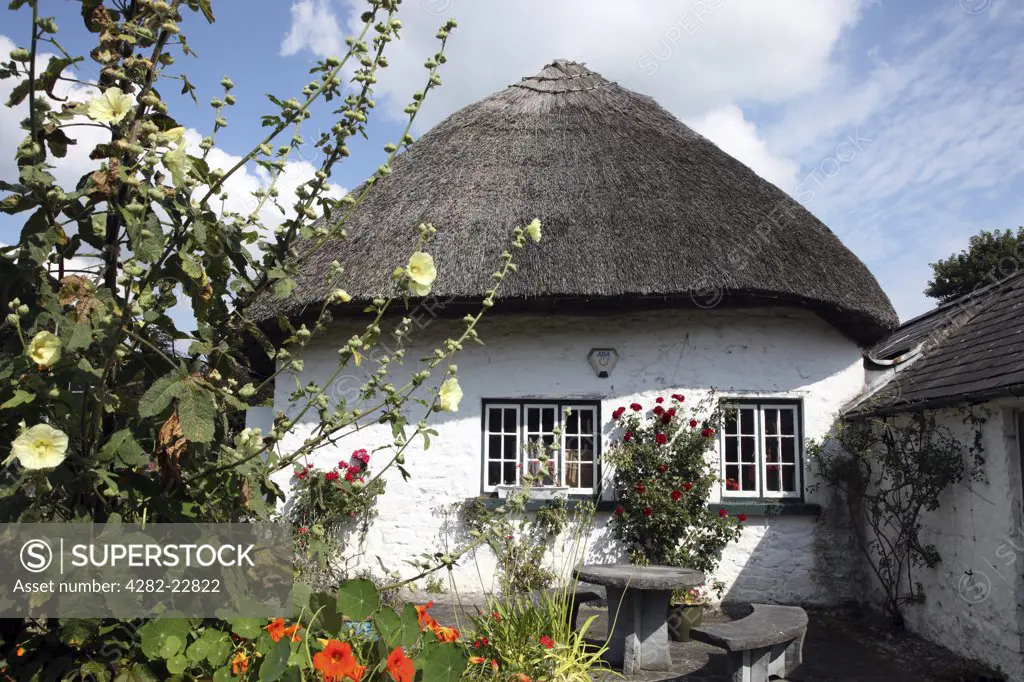 Republic of Ireland, County Limerick, Adare. Thatched cottage in Adare, a small village famous for its antique shops.