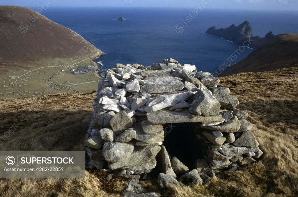 Scotland, Western Isles, St Kilda. A cleit overlooking Village Bay on the island of Hirta, one of four volcanic islands that make up the St Kilda archipelago abandoned in 1930.