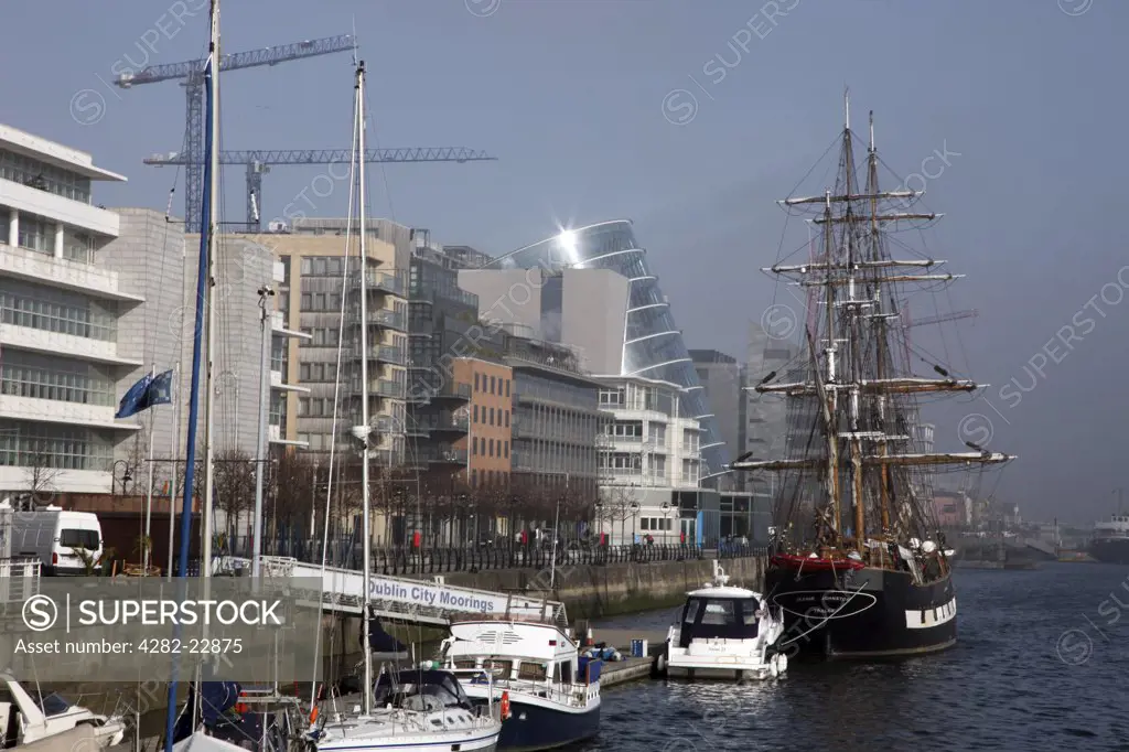 Republic of Ireland, Dublin, Dublin. Boats and a tall ship at Dublin City Moorings on the River Liffey in the North Wall area.