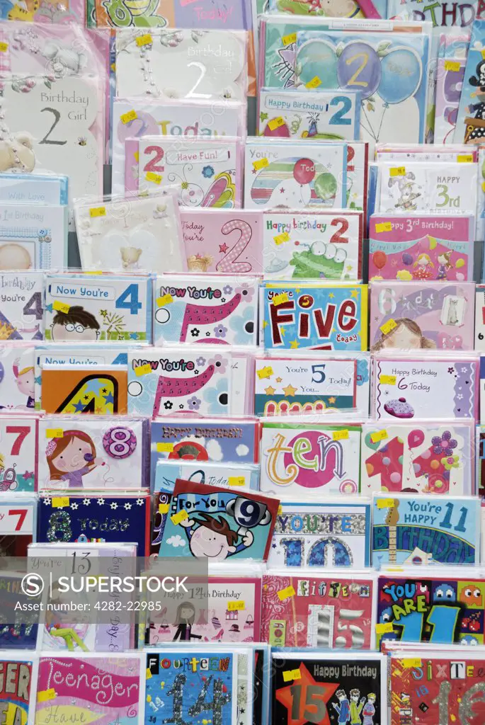 England, London. A display of children's birthday cards for sale in a shop.