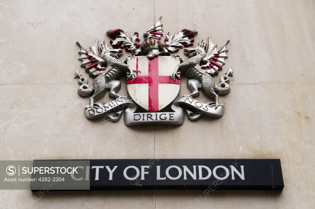 England, London, City of London. The City of London coat of arms bearing the Latin motto Domine Dirige Nos  which means Lord, Guide Us.