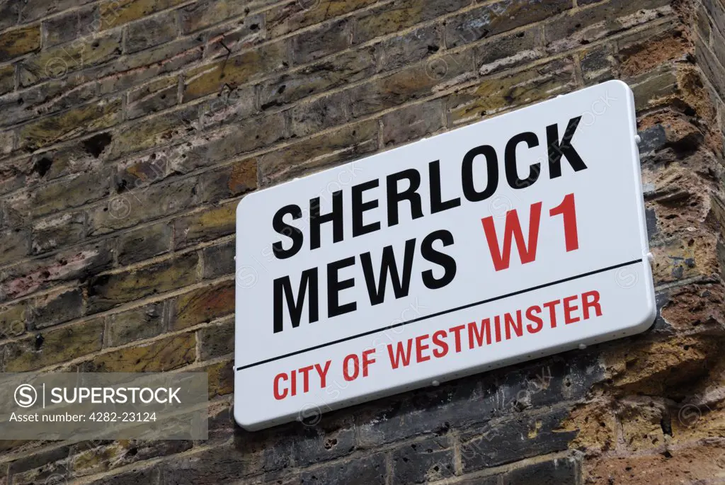 England, London, Marylebone. Sherlock Mews W1 London street sign on a wall.