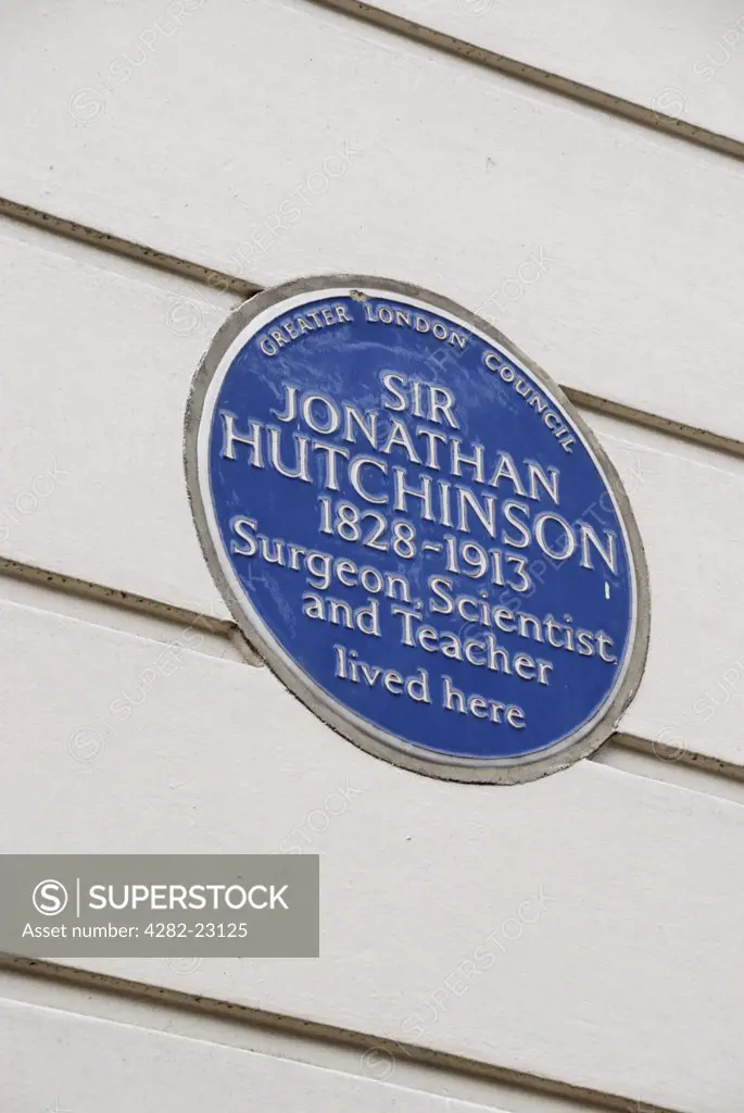 England, London, Marylebone. Blue plaque commemorating Sir Jonathan Hutchinson, surgeon scientist and teacher, lived at 15 Cavendish Square W1.