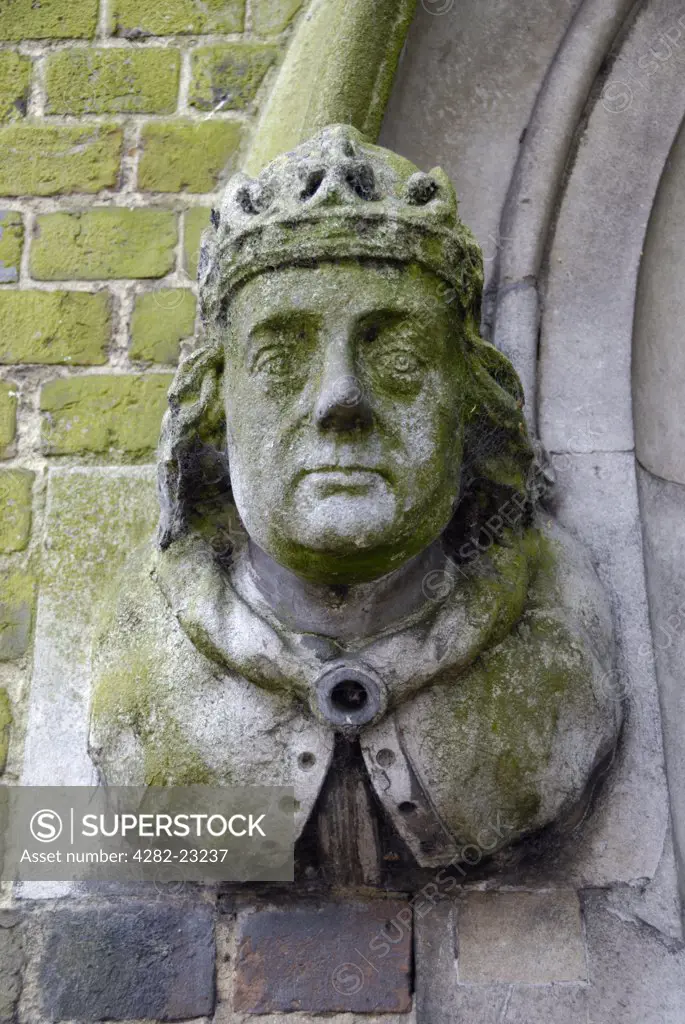 England, Hampshire, Winchester. Statue of a king outside the entrance to St Johns Winchester Charity Almshouses.