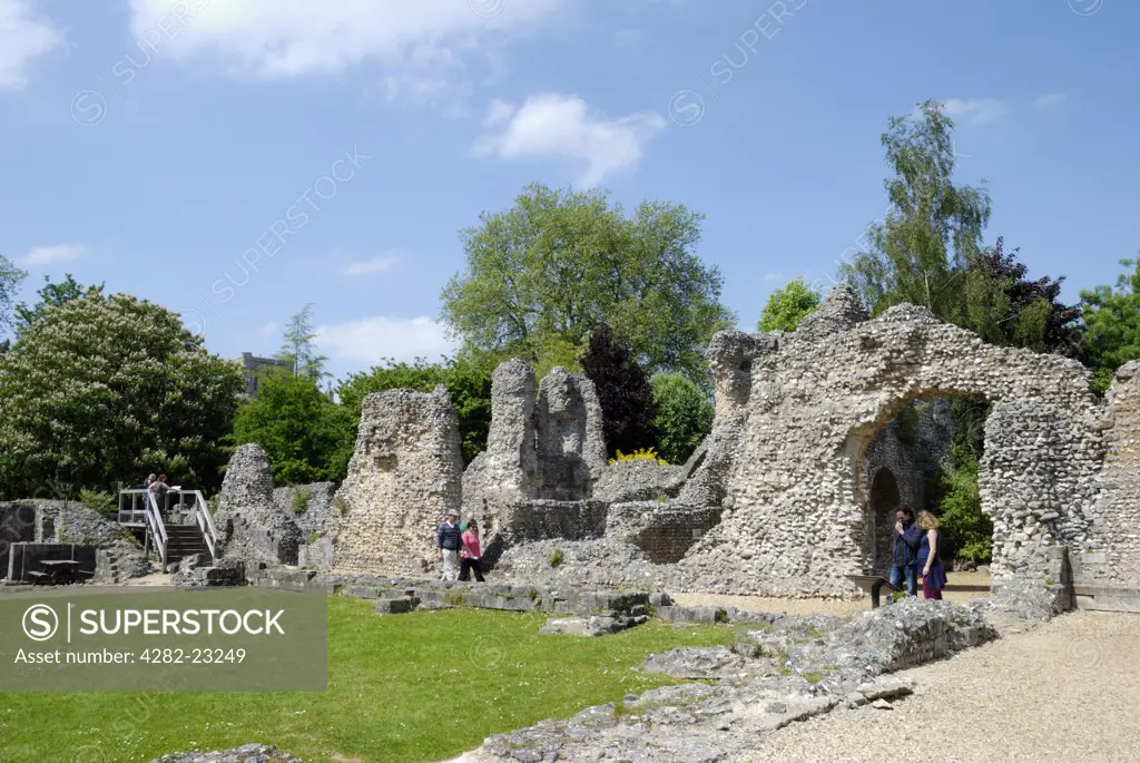England, Hampshire, Winchester. Tourists looking around the remains of Wolvesey Castle (old Bishop's Palace), former principle residence of the wealthy and powerful Bishops of Winchester since Anglo-Saxon times.