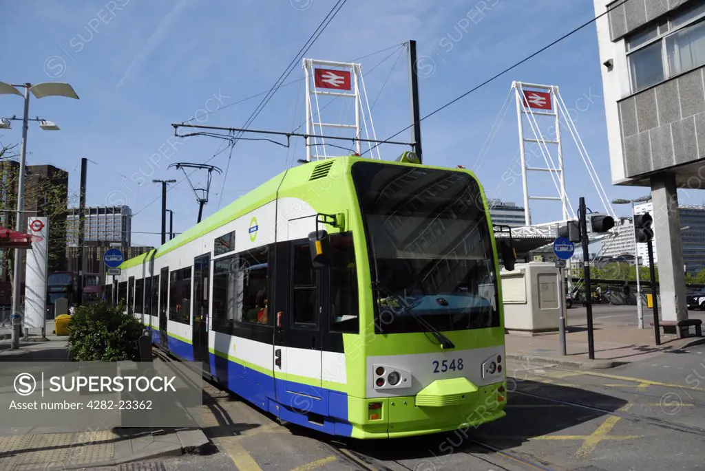 England, Surrey, Croydon. A tram on Croydon Tramlink outside East Croydon Railway Station.
