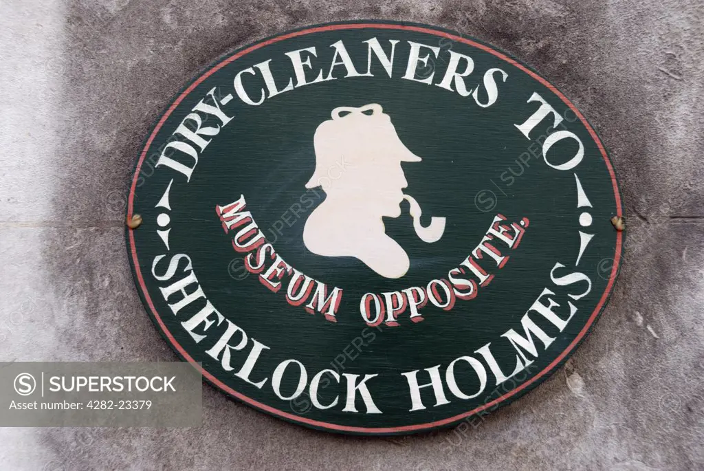 England, London, Baker Street. Dry Cleaners to Sherlock Holmes sign outside the shop opposite the Sherlock Holmes Museum.