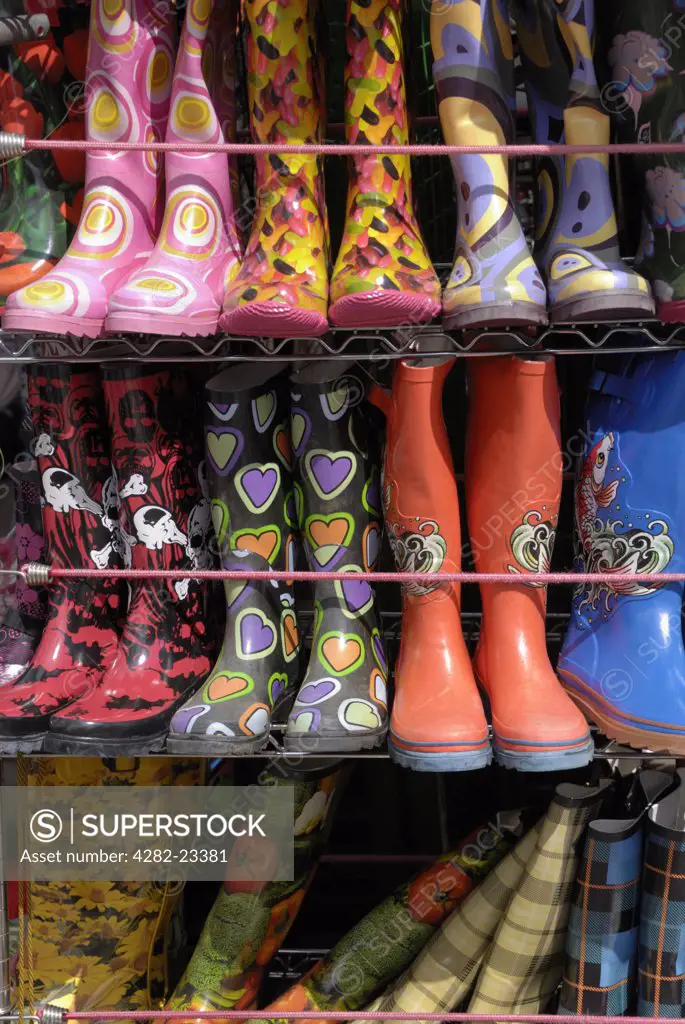 England, London, Camden. Colourful Wellington boots for sale on a market stall in Camden.