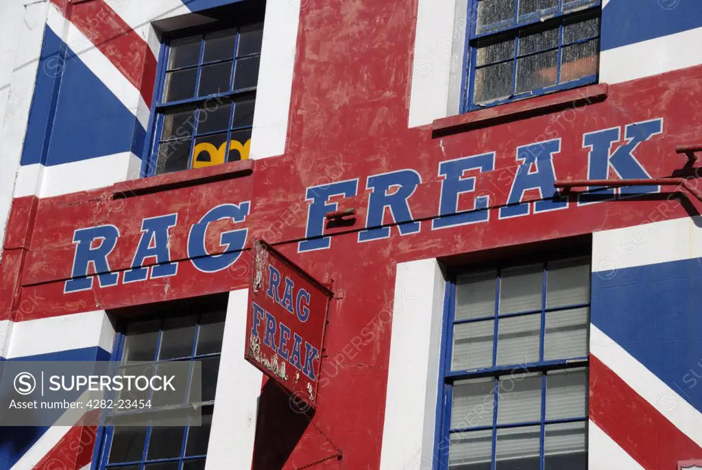 England, City of Brighton and Hove, Brighton. Large Union Jack painted on the exterior of Rag Freak clothes shop.