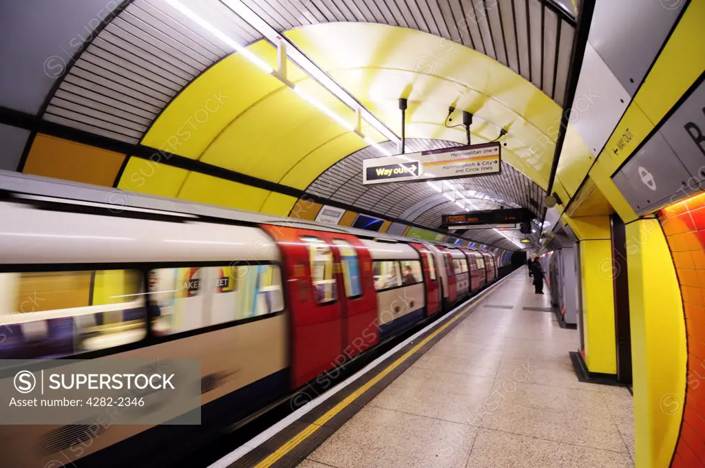 England, London, Baker Street. A tube train on the Jubilee line departing a platform at Baker Street Underground Station.