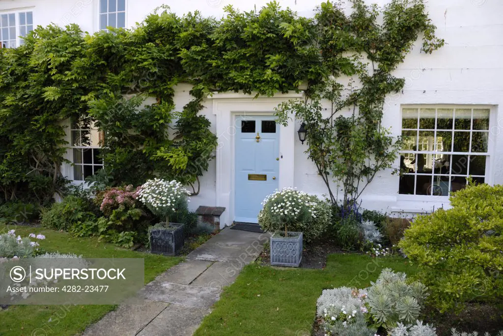 England, West Sussex, Chichester. The front entrance to an attractive cottage near Chichester Cathedral.