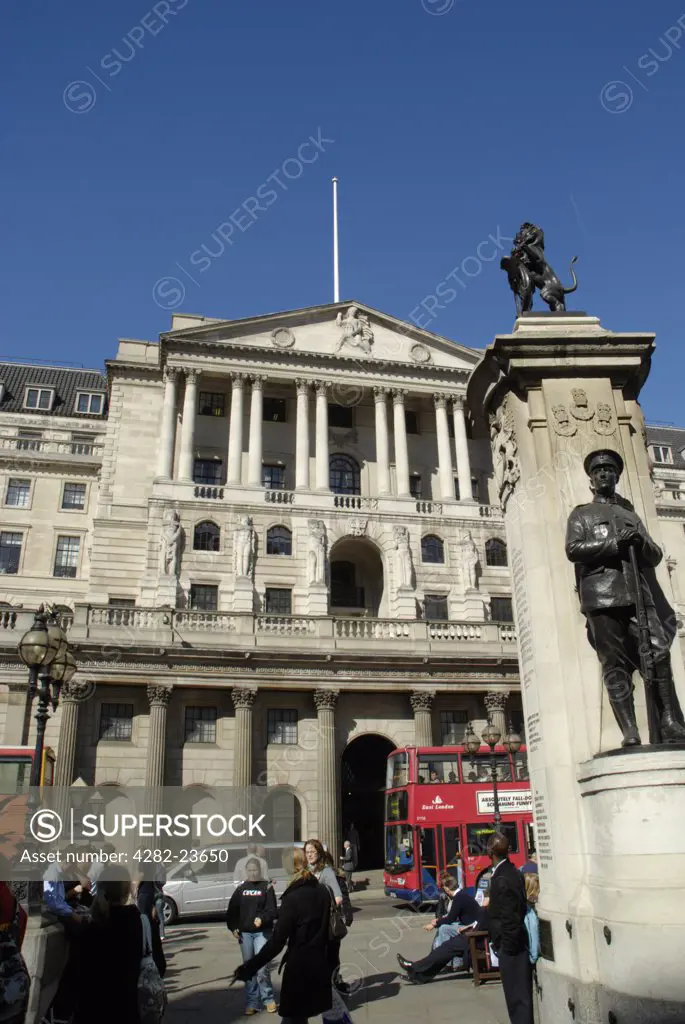 England, London, The City. Exterior view of the Bank of England and office workers in Threadneedle Street.