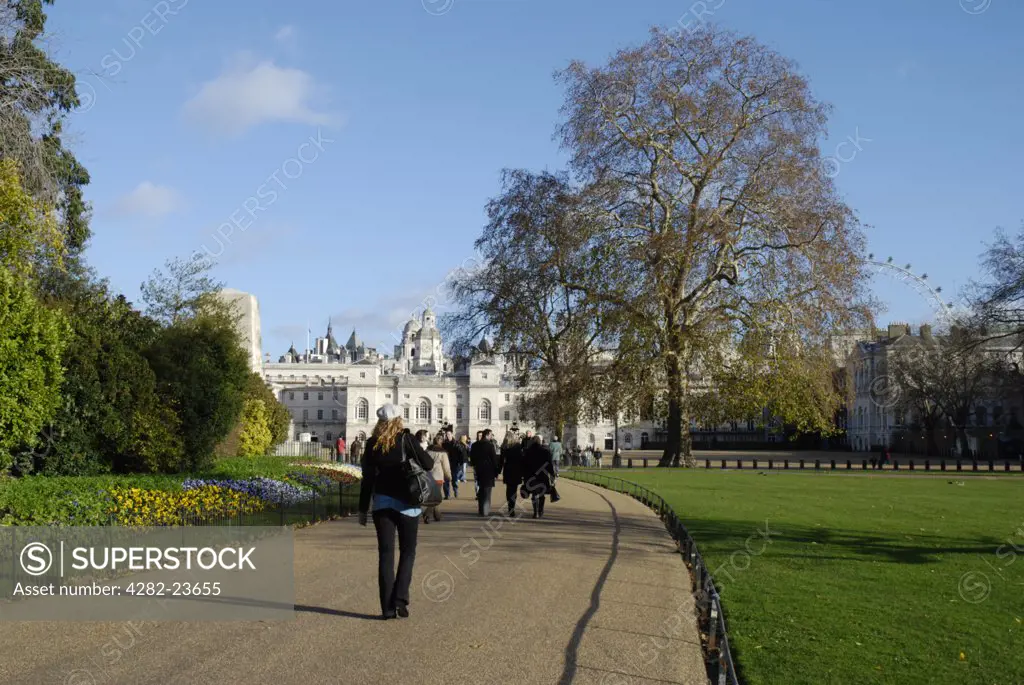 England, London, Westminster. A view of people strolling in St James Park in Westminster.