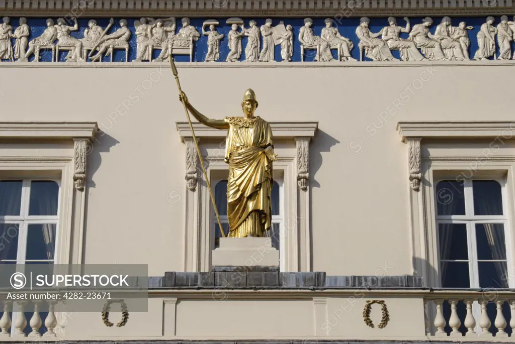 England, London, St James's. A close up of Athena statue and frieze on the exterior of the Athenaeum Club in London.