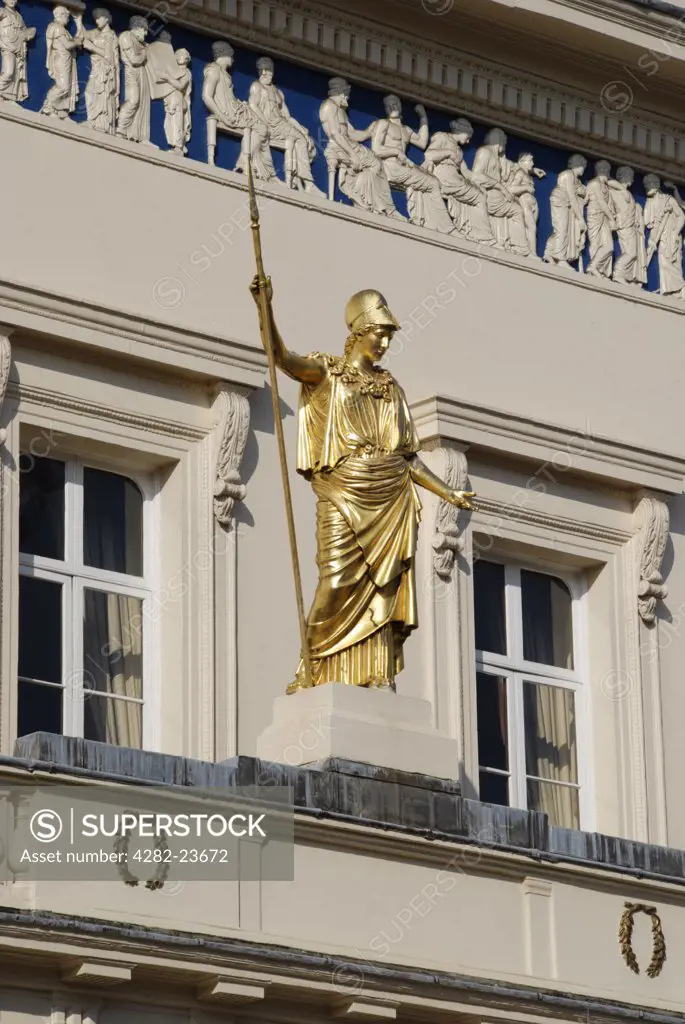 England, London, St James's. A close up of Athena statue and frieze on the exterior of the Athenaeum Club in London.