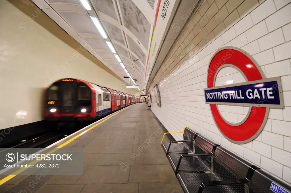 England, London, Notting Hill Gate. A Central line tube train departing Notting Hill Gate underground station.
