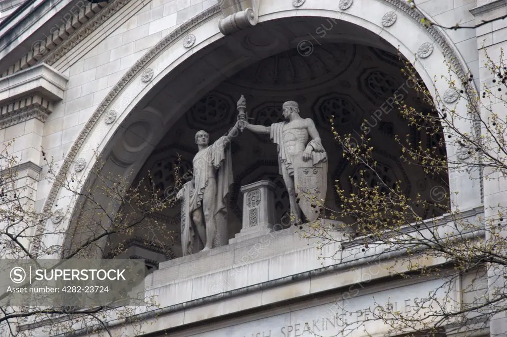 England, London, Aldwych. Looking up to statues above the entrance to BBC Bush House in Aldwych.