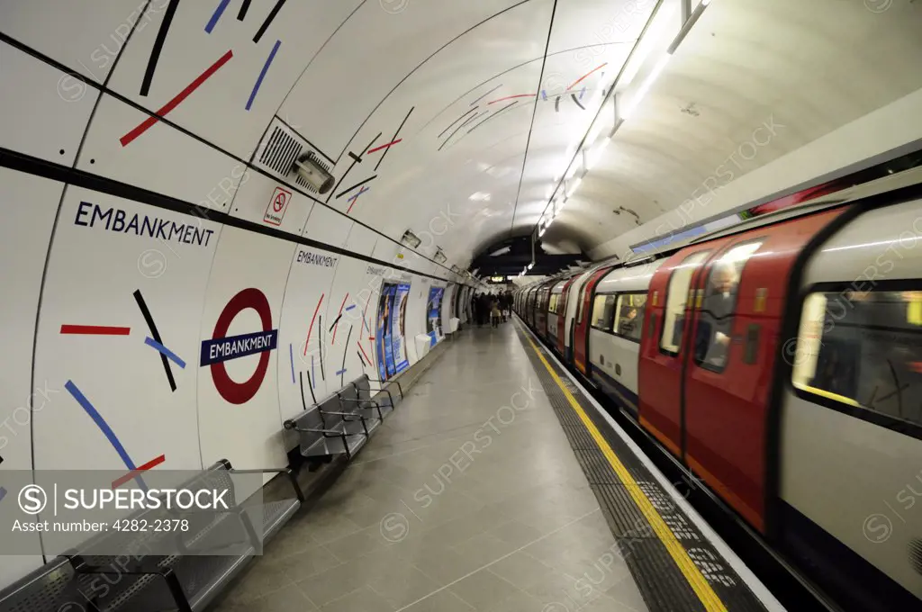 England, London, Embankment. A Northern line tube train departing from Embankment Underground station.