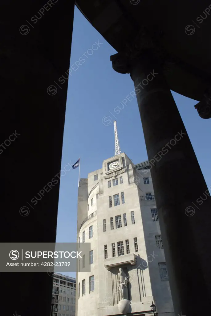 England, London, Westminster. Broadcasting House viewed from between the pillars of the nearby All Souls Church.