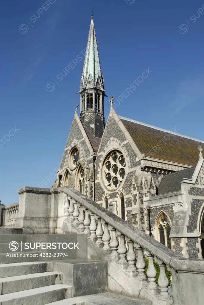 England, London, Harrow on the Hill. A blue sky backdrop to Harrow Public School chapel and stone staircase.