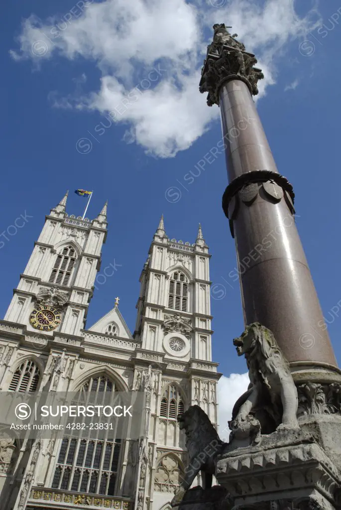 England, London, Westminster. Western aspect of Westminster Abbey and nearby memorial column.