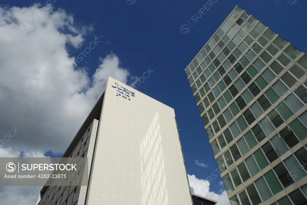 England, Buckinghamshire, Milton Keynes. View looking up at Jurys Inn hotel and nearby office building.