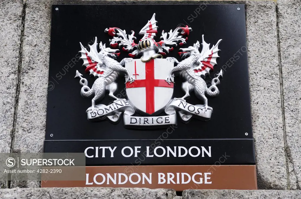 England, London, London Bridge. City of London Coat of Arms on London Bridge.