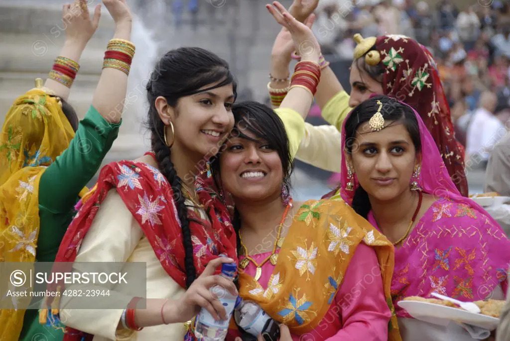 England, London, Trafalgar Square. Sikh female dancers in colourful traditional costumes at the 2008 Vaisakhi Sikh New Year Festival.