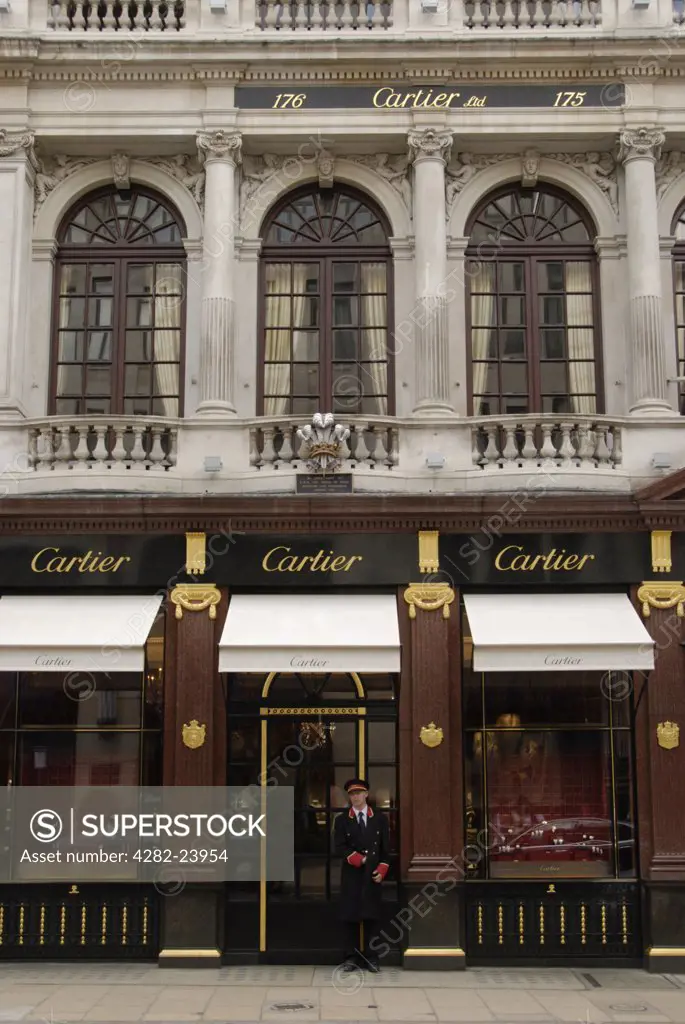 England, London, Bond Street. Doorman standing outside Cartier jewellers in Old Bond Street.