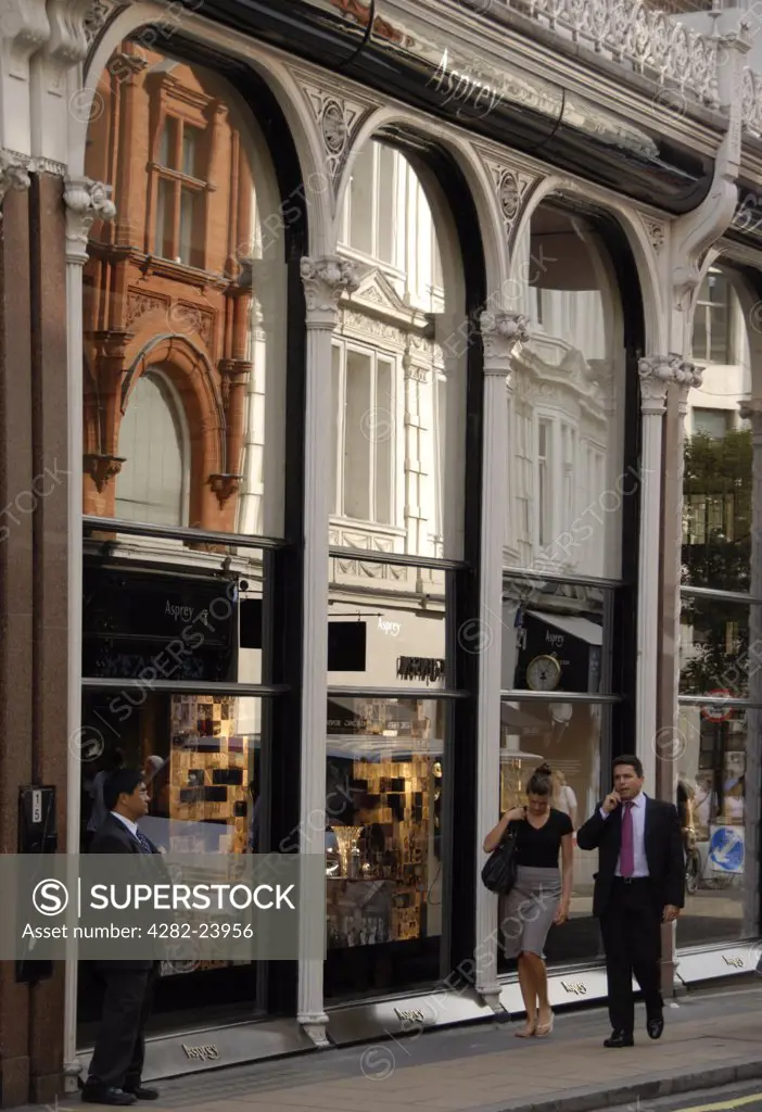 England, London, Bond Street. Reflections in the shop front of Asprey jewellers on New Bond Street.