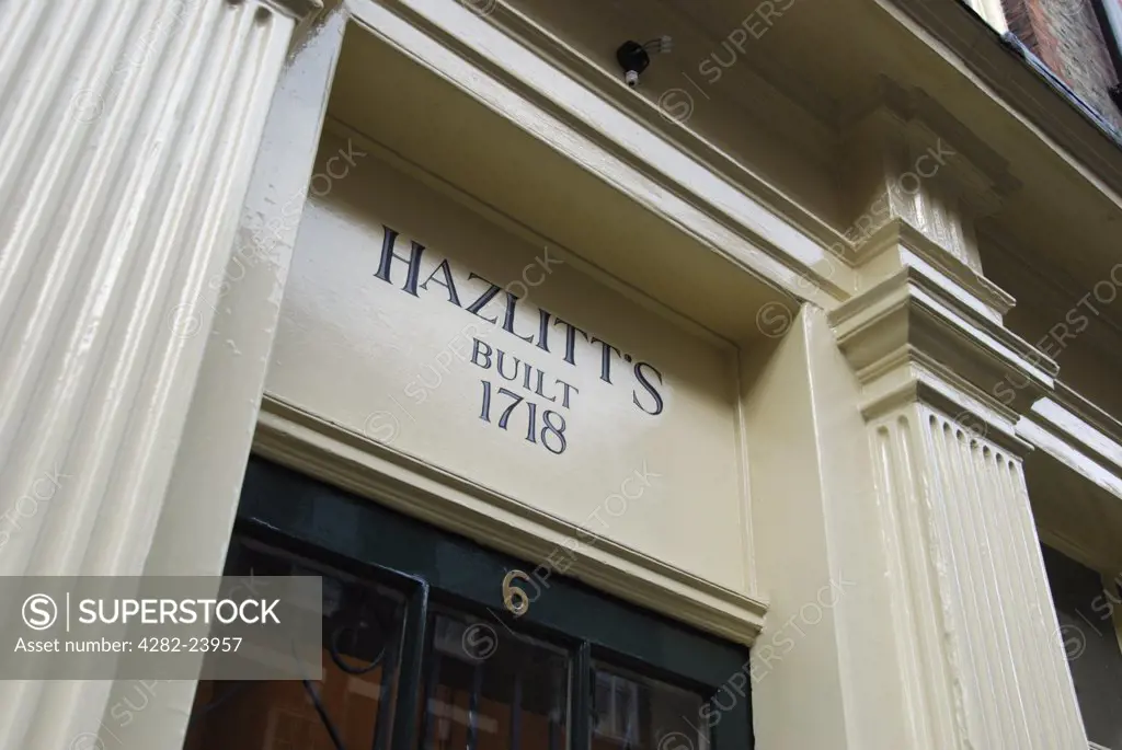 England, London, Soho. Looking up to text for the Hazlitts Hotel on Frith Street.