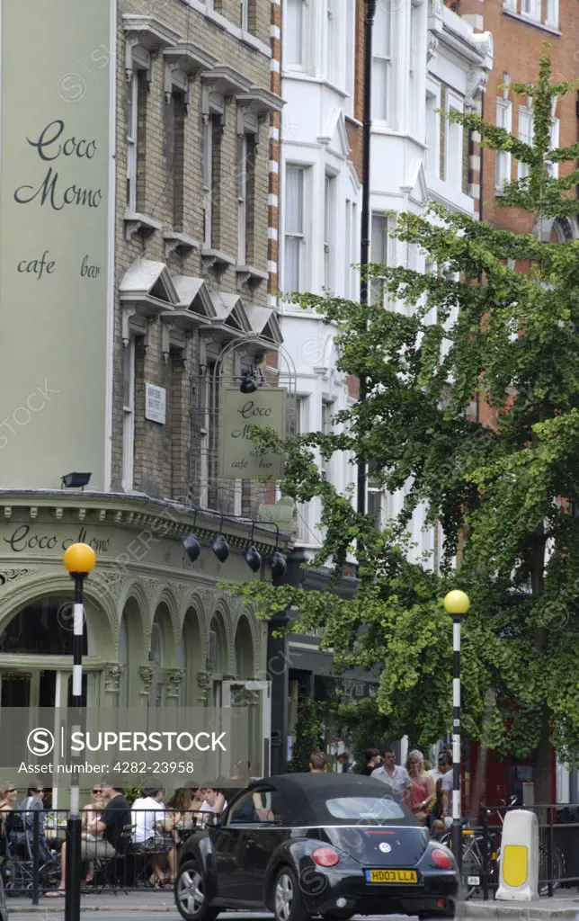 England, London, Marylebone. Exterior view of a bar and row of buildings on Marylebone High Street.