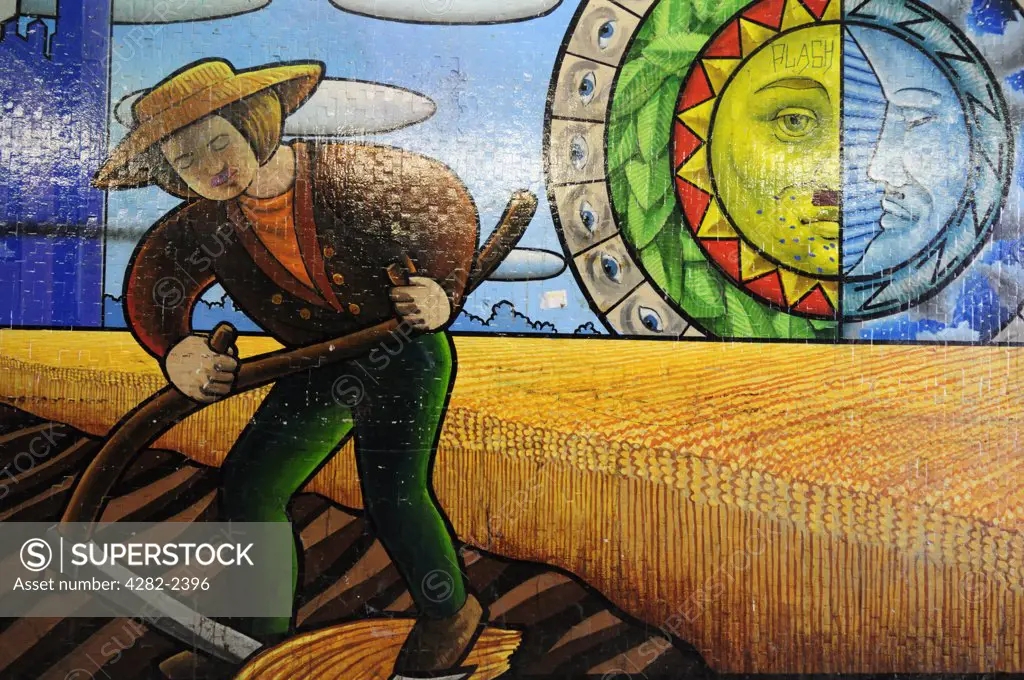 England, Cambridgeshire, Cambridge. A mural depicting a traditional harvest scene in the subway under Newmarket Road.