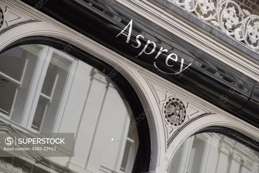 England, London, New Bond Street. Exterior view of the Asprey jewellers sign and window reflections on New Bond Street.