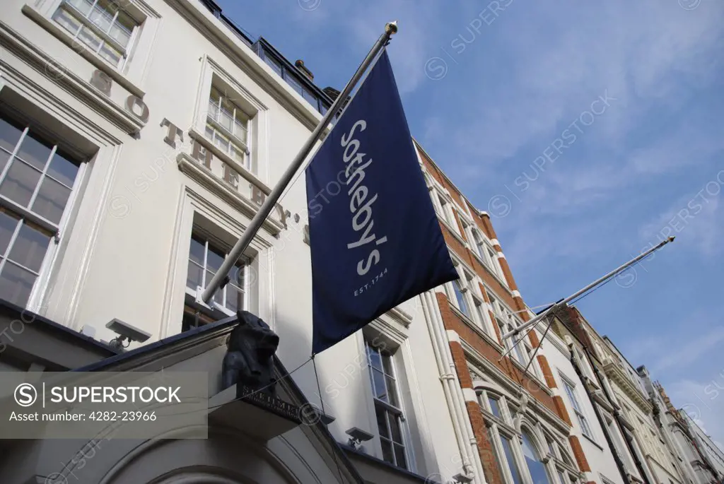 England, London, Bond Street. A banner hanging above the entrance to Sothebys on New Bond Street.
