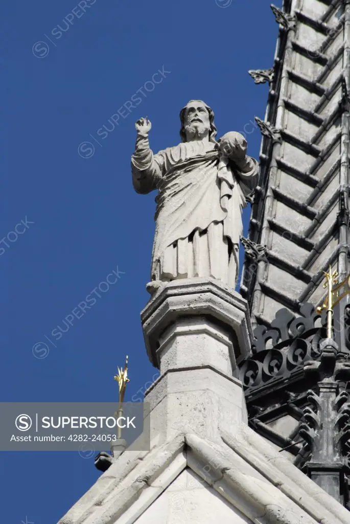 England, London, The Strand. Statue on roof above main entrance to the Royal Courts of Justice.