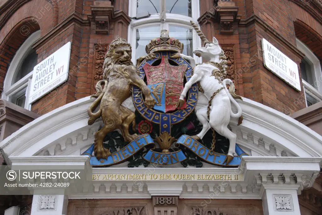 England, London, Mayfair. By Appointment to her Majesty the Queen crest above shop.