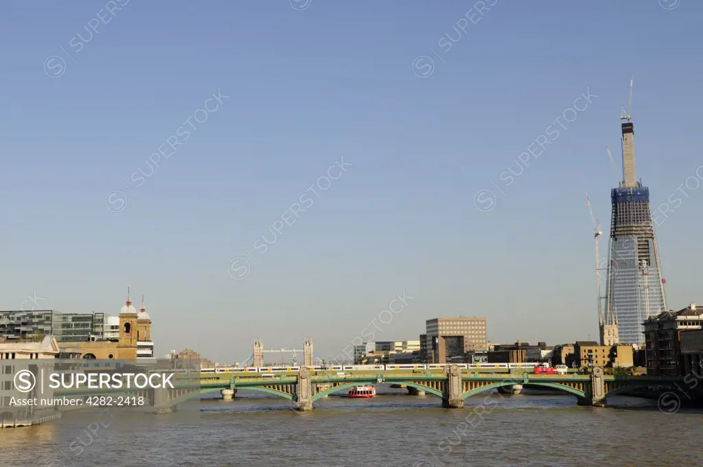 England, London, London Bridge. View along the River Thames towards Southwark Bridge and the Shard London Bridge.