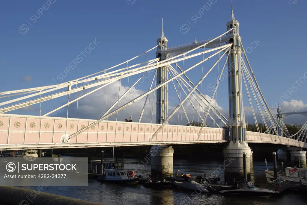 England, London, Chelsea. A view to the Albert Bridge from Chelsea Embankment.