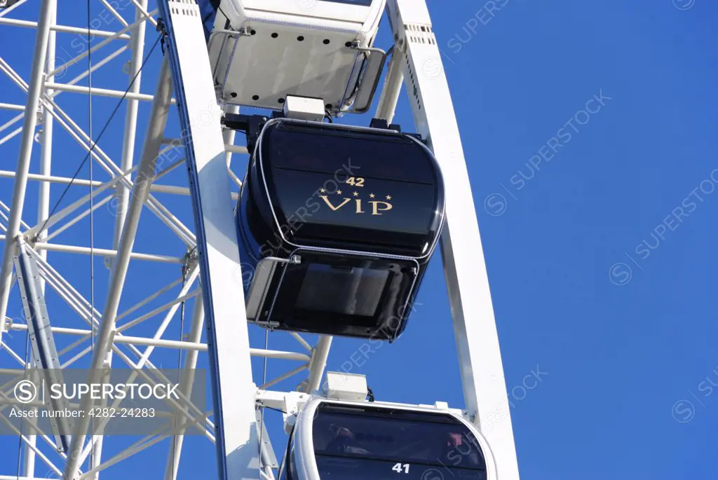 England, London, Hyde Park. A close up observation of a ferris wheel against a deep blue sky in Hyde Park.