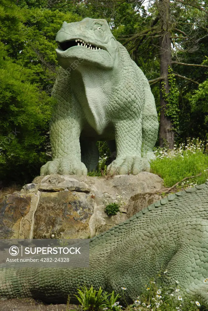 England, London, Crystal Palace. An Iguanodon dinosaur statue in Crystal Palace Park.